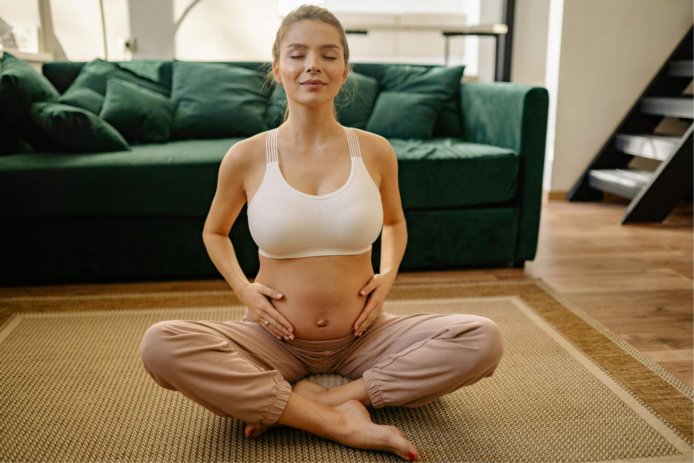 Pregnant woman meditating peacefully