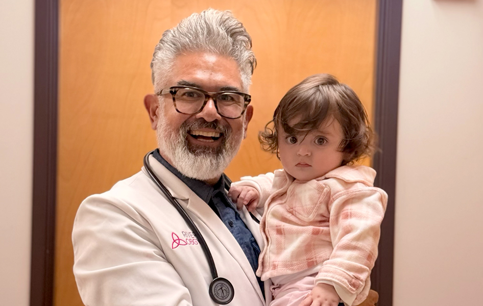 Dr. Rivera with a patient and newborn